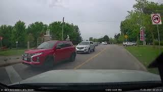 Close Call: Car Narrowly Avoids Crash in Busy Toronto Intersection!