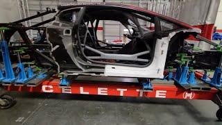 Lamborghini race car frame repair on Celette bench with dedicated fixtures