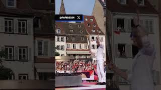 Arsene Wenger held the Olympic torch and lit the cauldron in his home town of Strasbourg 