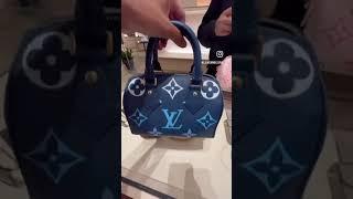 Louis Vuitton’s Speedy Bandouliere 20 in Blue in Monogram Empreinte embossed leather