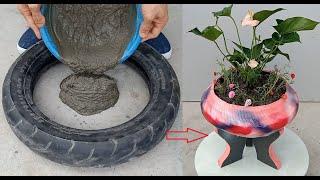 Unique flower pots are made from old tires and cement