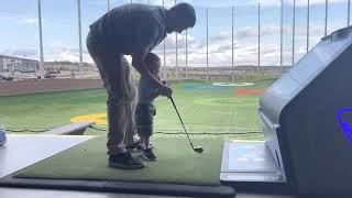 Baby and Daddy Hitting Balls
