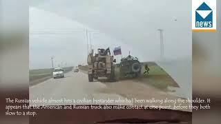 US military vehicle running a Russian military truck off the road in Syria