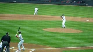 Carl Pavano throws the first professional pitch at Target Field