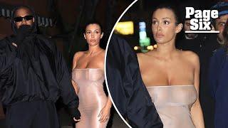 Bianca Censori wears completely sheer tube dress and knee-high stockings for Kanye West outing