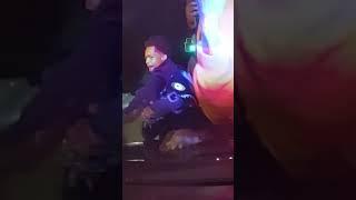 Street takeover in Cleveland shows people jumping on police officer's hood of car