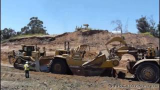 CAT D9T push loading 657E scrapers