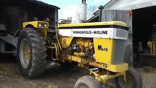 Mixing feed for the cows.