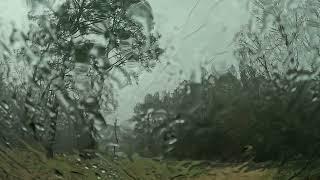 Raining on a windshield in a parked car