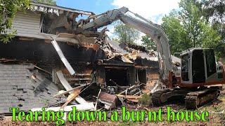 Tearing Down A Burnt House