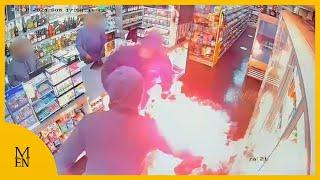 Moment convenience store is doused in petrol and set alight