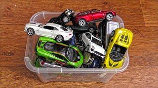 Box Filled With Lots of Various Toy Cars