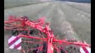 JD 3020 pulling Kuhn GA 6002 rake