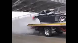 Mercedes AMG doing burnout on tow truck