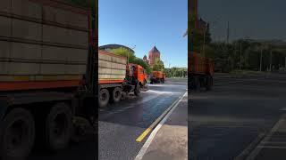 In Moscow, municipal services wash the roads. Hot day.