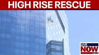 Window washers dangle from 78th floor of Manhattan high rise