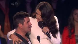 Khloé Kardashian Odom sits on Simon Cowell's lap making him blush