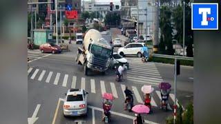 Concrete mixer truck flips over after collision, injuring 3 in China