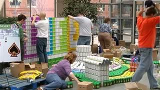 Builders make sculptures out of canned food