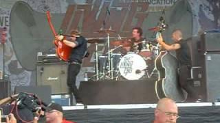 The Living End- Chris playing with beer bottle