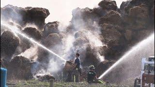 Crews from several departments tackle large hay bale fire in Tecumseh