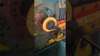 The process of forging, bending and cooling a metal spring