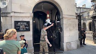 Heartwarming Moment: Soldier Cools Down King's Guard Horse with Refreshing Water Rub