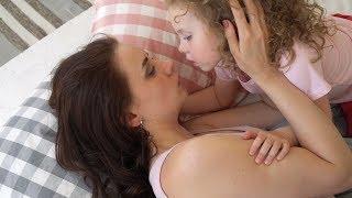 Family, mother and daughter kissing on bed