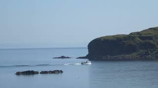 An Islay Sea Adventures boat passes the uninhabited island of Texa Islay Argyll Scotland on 31.5.23