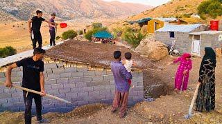 "Family Teamwork: Covering Milad and Mahin's Roof with Plastic and Soil"