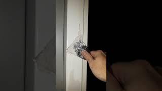 Applying filler to a dent in a door post