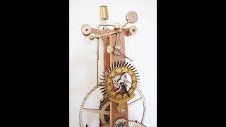 A Franklin Three Wheeler Clock in Wood