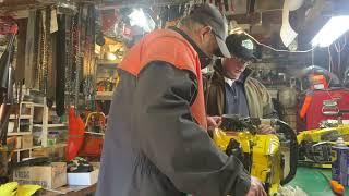 Donny walkers chainsaws checking out old McCulloch parts at Bobby walkers