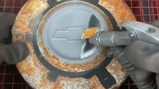 Sandblasting a Rusty Hubcap