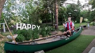 Raccoon fishing from canoe