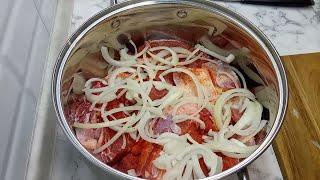 Meat dish of beef with vegetables on beer. HASHLAMA