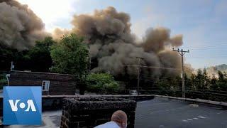 Chimney Implosion Creates Giant Dust Cloud | VOA News