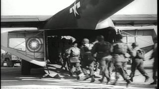 A United States glider being towed and paratroopers land during a maneuver in the...HD Stock Footage