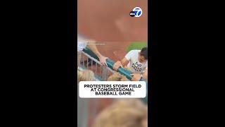 Climate protesters storm field at Congressional Baseball Game