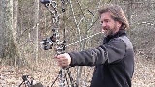 Tim Farmer Shooting a Bow With His Teeth