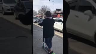 Nicole rides a scooter