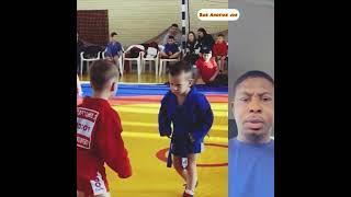 This kid won his wrestling match even before it began . His intimidating look scared his opponent