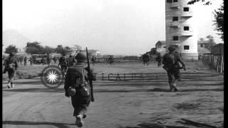 US Army soldiers recover German Panzer III Ausf L Flamethrower tank, in a village...HD Stock Footage