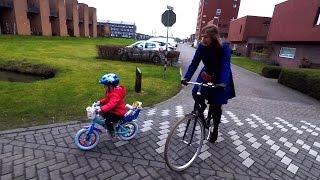 3 year old Dutch kid riding a bike in Holland