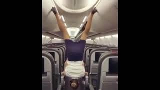 Russian Air Hostess Closes Plane s Luggage Flaps With Her Legs