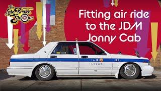 JDM Nissan Tokyo Taxi fitted with Air Lift air bag suspension - in detail