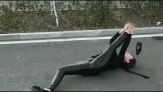 Girl does splits on the car and then oops