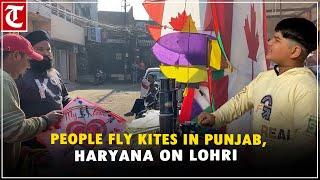 People fly kites on occasion of ‘Lohri’ festival in Punjab, Haryana