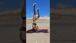 Beach yoga arms balance and core strength