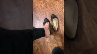 Sweaty black ballet flats with heel popping